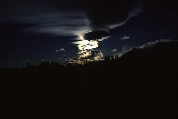 moonrise behind cloud