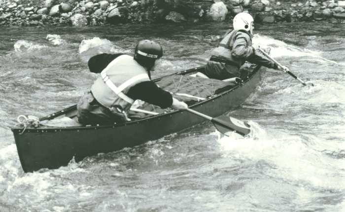canoeists in whitewater